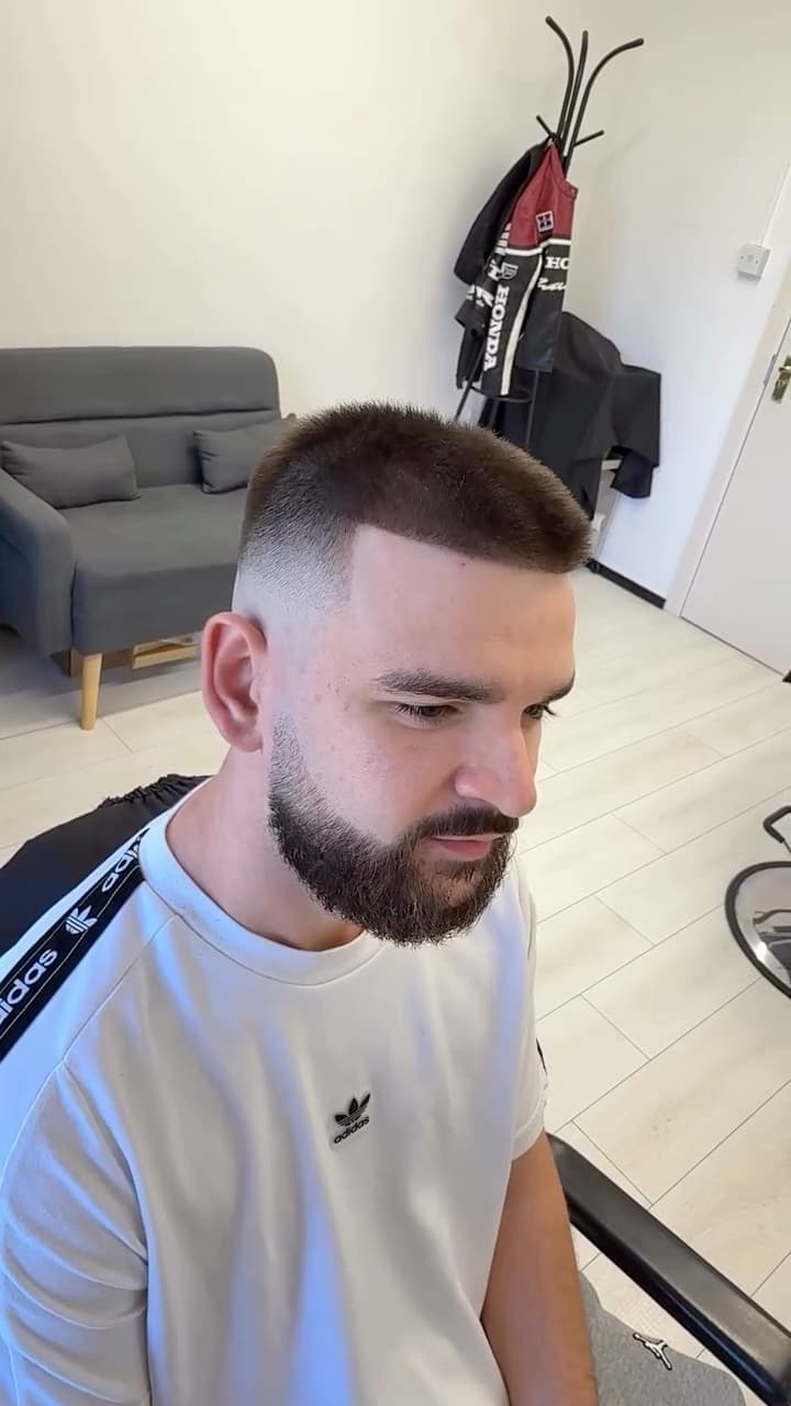 Skin fade blended into a full beard, by Bucks