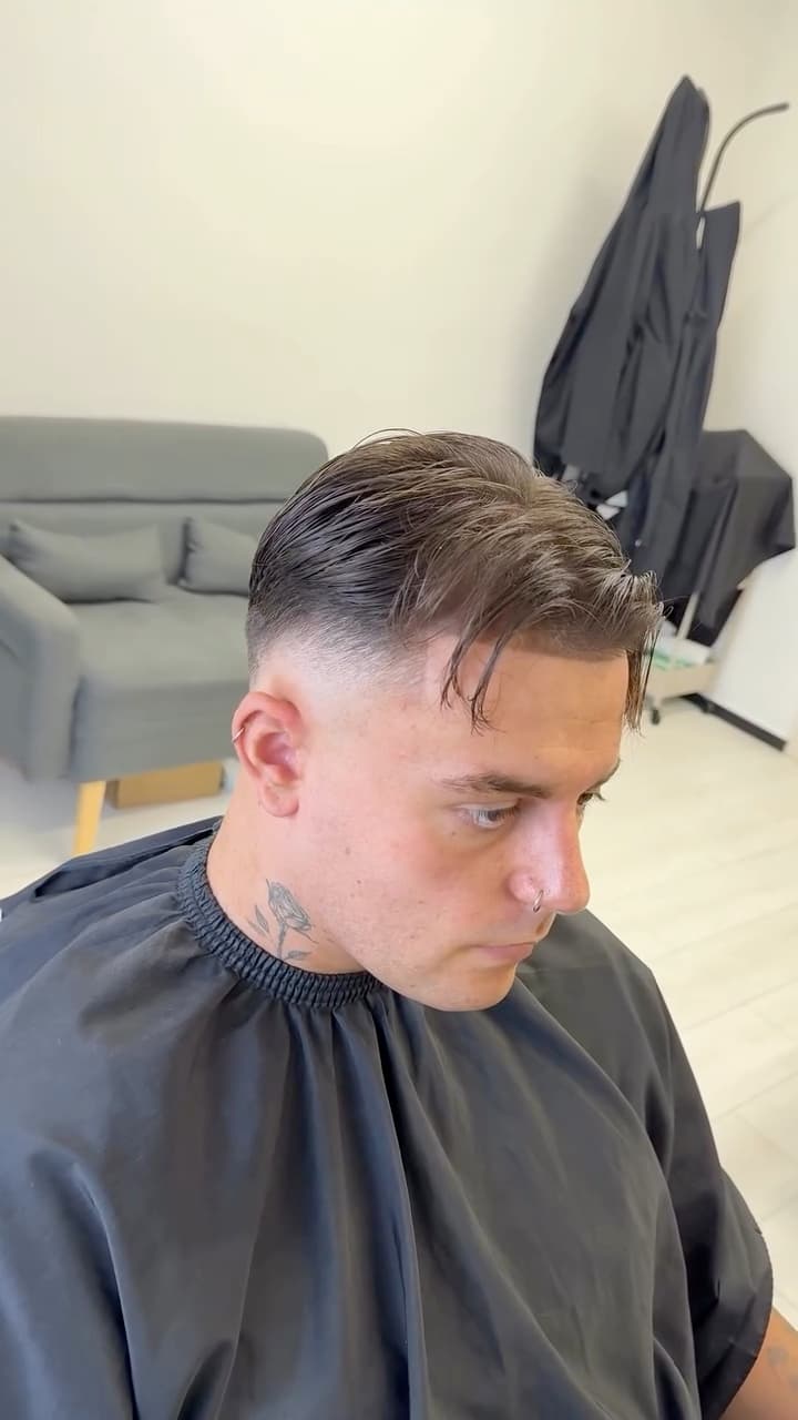 Slicked back style with a fade, by Bucks