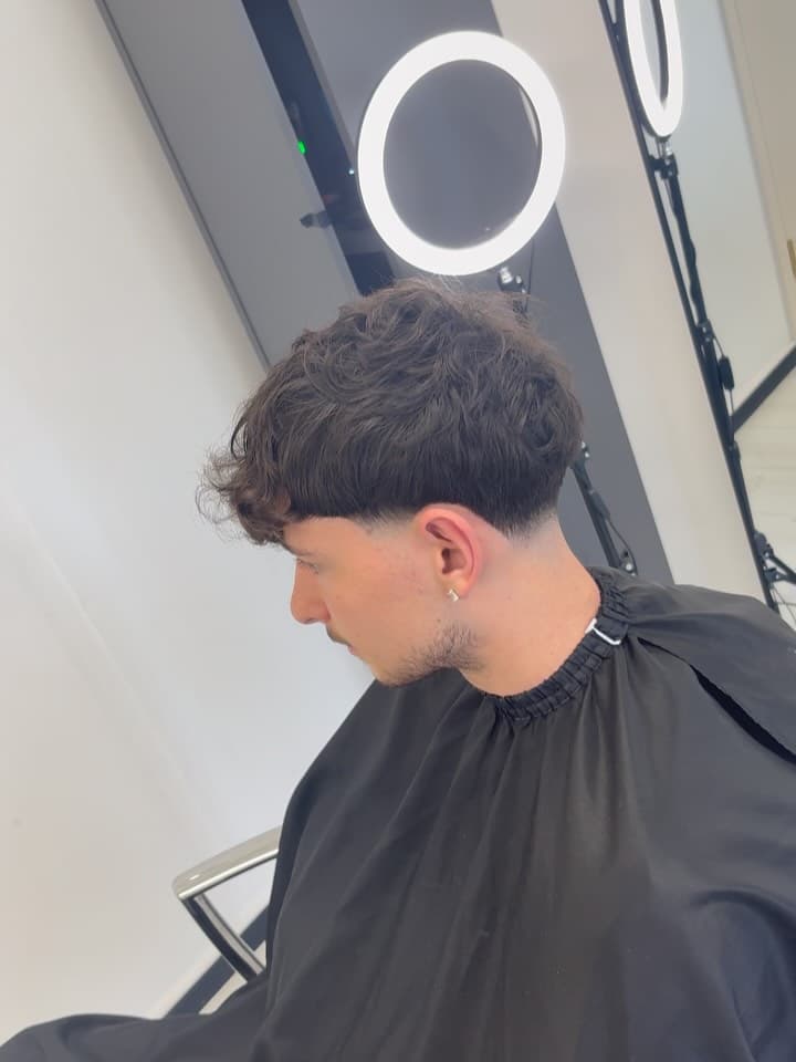Dark textured crop with a low fade, by Fin