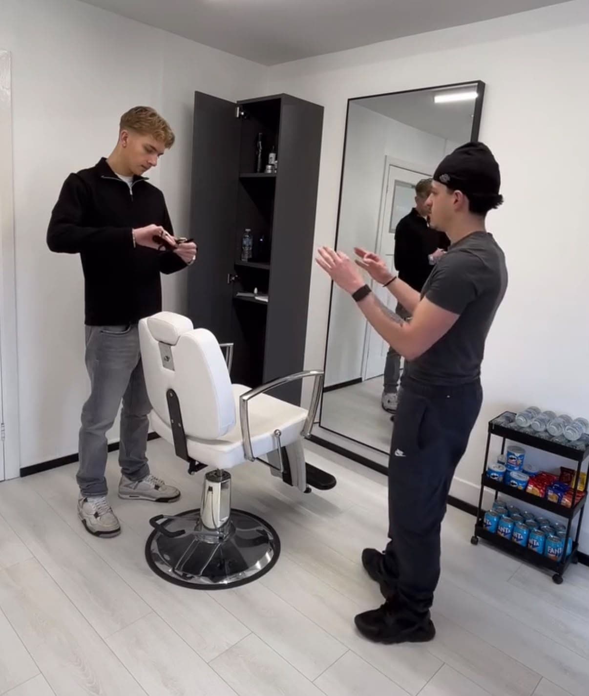 Bucks coaching a barber through a technique in the studio